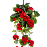 De Kunst hangplant Geranium 75 cm rood heeft levendige rode kunstgeraniumbloemen met weelderige groene bladeren die elegant naar beneden vallen.