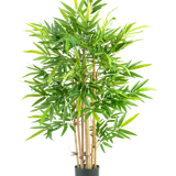 De Kunstplant Bamboe 120 cm is een hoge bamboe in pot met meerdere dunne gelige stengels en veel lange, smalle groene bladeren, tegen een effen witte achtergrond.