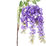 Een Kunstbloem Blauweregen 115 cm paars met paarse blauwe regen bloemen en groene bladeren tegen een witte achtergrond.