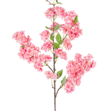 De Kunst Kersenbloesem 100 cm roze is een enkele kunstmatige kersenbloesemtak met trossen felroze bloemen en groene bladeren, perfect voor decoratief gebruik.