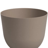 De Plantenbak Havanna Ø30cm x H25cm is een effen, ronde bloempot in lichtbruin met een gladde matte afwerking, licht uitlopende rand en minimalistisch design. De pot is leeg en ideaal voor moderne ruimtes.